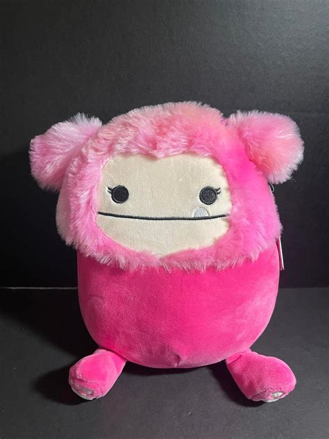Pink bigfoot squishmallow - This ultra-squeezable, 8-inch, little pink bigfoot plush is made with high-quality and ultrasoft materials. Add this adorable bigfoot plush to your Squishmallow Squad! The soft bigfoot plush is perfect to snuggle with while relaxing at home, watching a movie, or taking a long car or plane ride!